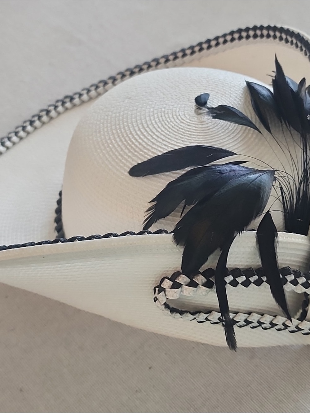 Classic Black and White Derby Hat with Black Feather Trim